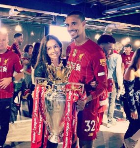 Joel Matip And wife Larissa Stollenwerk lifting the Premier League Trophy