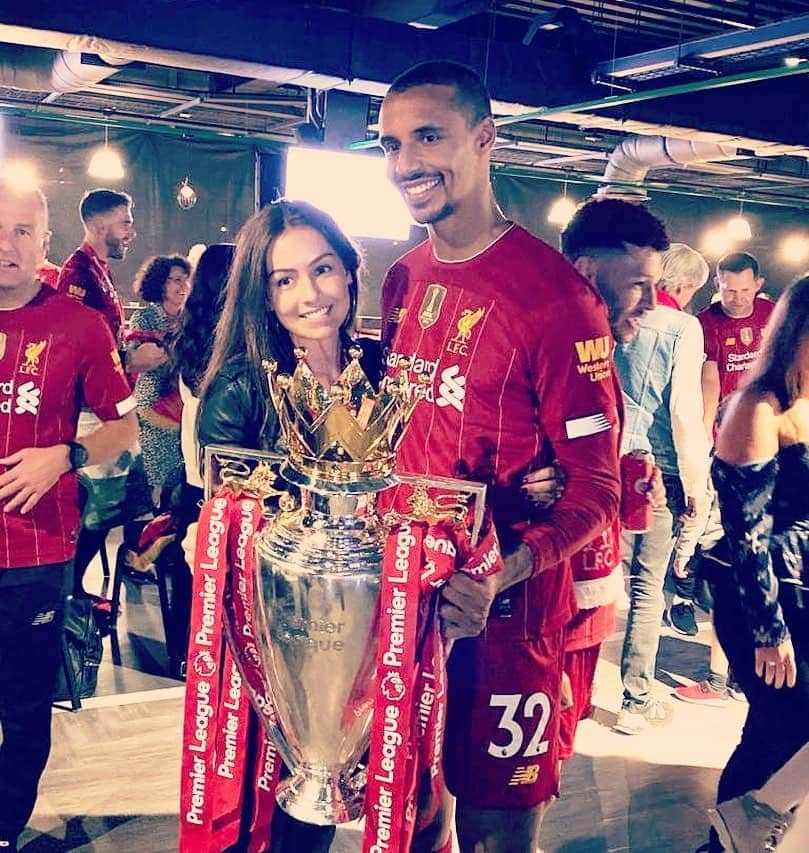 Joel Matip And wife Larissa Stollenwerk lifting the Premier League Trophy