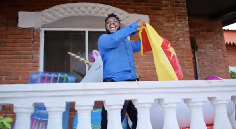 Nigerian Comedian Sabinus Flaunts Cameroon Flag on Kizz Daniel’s “BUGA” Video